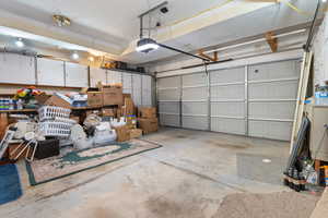Garage featuring a garage door opener