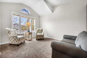 Living area with carpet flooring and baseboards