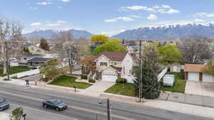 Aerial view of residential area featuring a mountain backdrop