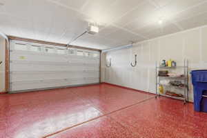 Garage featuring a garage door opener