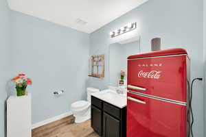 Bathroom with vanity and light wood-style flooring