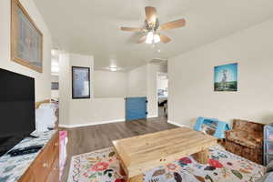 Dining area with light wood finished floors and a ceiling fan