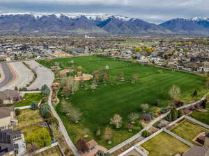Within Walking Distance to 17 Acre Park. Aerial perspective of suburban area with a mountain backdrop