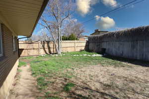 View of fenced backyard