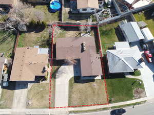 Aerial view of residential area with property parcel outlined