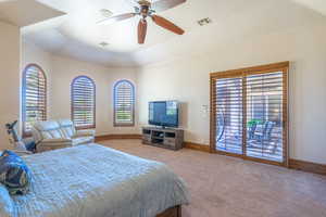 Bedroom with light colored carpet, a ceiling fan, and access to outside