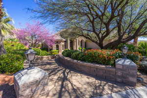 View of front of house featuring stone siding and stucco siding