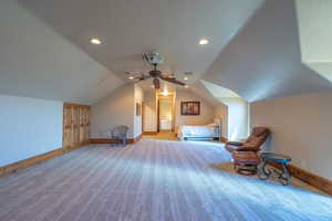 Bedroom featuring lofted ceiling, recessed lighting, light carpet, and ceiling fan