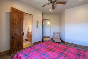 Bedroom featuring a ceiling fan, recessed lighting, and ensuite bath