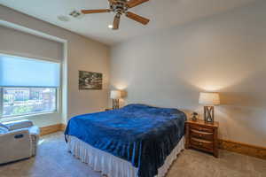 Bedroom featuring carpet and a ceiling fan