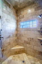 Bathroom featuring a tile shower