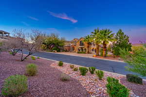 Mediterranean / spanish-style house featuring stone siding and stucco siding