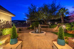 Patio at night with a patio area