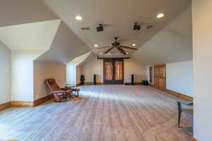 Additional living space featuring recessed lighting, vaulted ceiling, a ceiling fan, and light colored carpet