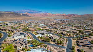 Aerial perspective of suburban area with a mountainous background