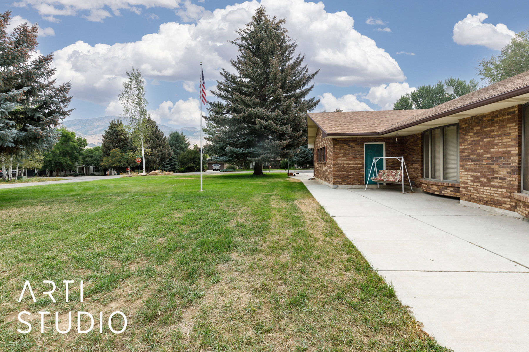 View of grassy yard and front of home