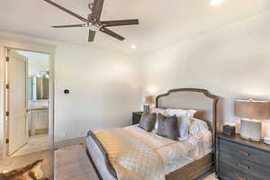 Bedroom featuring ceiling fan, ensuite bathroom, and recessed lighting