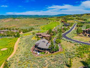 Aerial view of a local golf course and a mountain backdrop