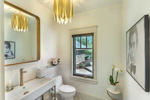 Bathroom with vanity and a chandelier