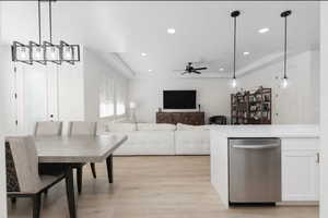 Dining space with recessed lighting, light wood-type flooring, and a ceiling fan