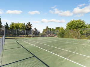 View of tennis court featuring community basketball court
