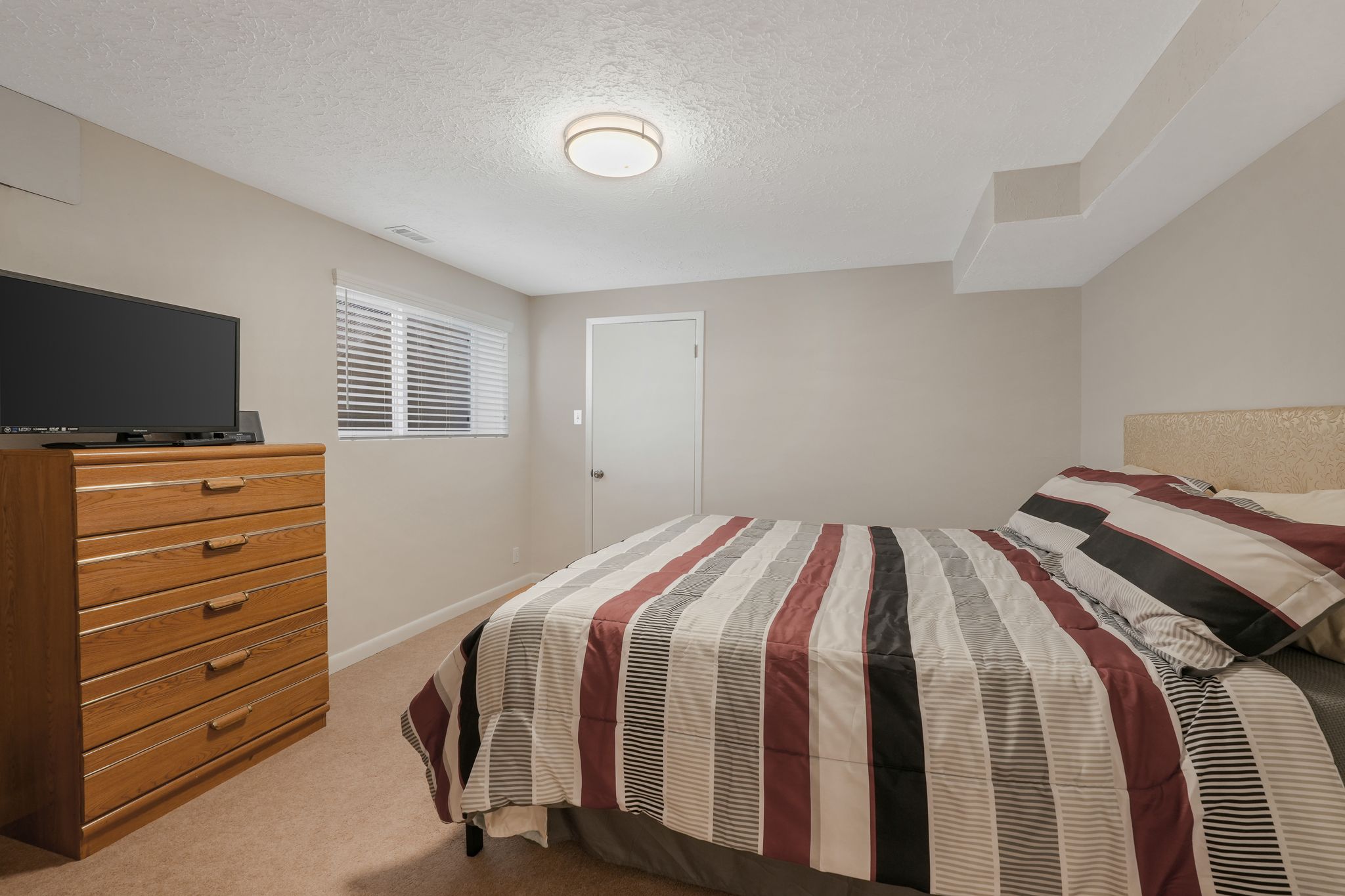 Primary ensuite Full bathroom with bathing tub / shower combination and baseboards