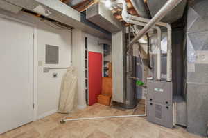 Kitchen with light countertops, electric range, white cabinetry, recessed lighting, and light tile patterned flooring