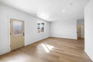 Spare room with light wood-style flooring and recessed lighting
