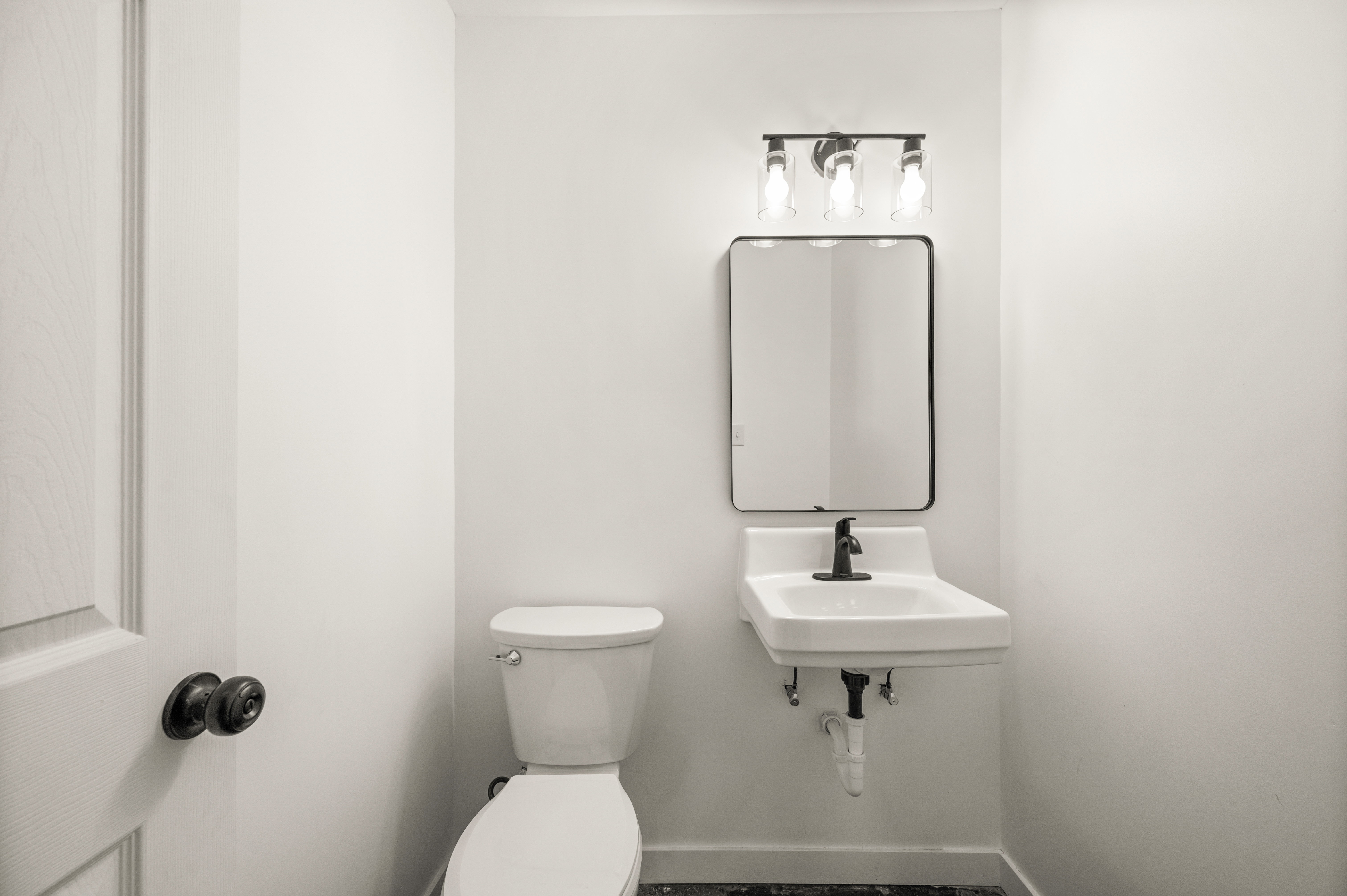 Bathroom with toilet and baseboards