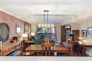 Dining area featuring a fireplace and wood finished floors