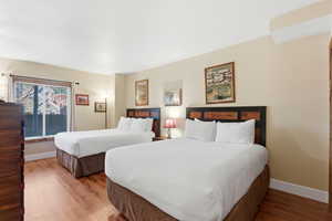 Bedroom featuring light wood-style floors and baseboards
