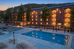 Community pool featuring a patio area