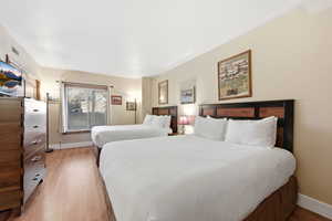 Bedroom with light wood-style flooring