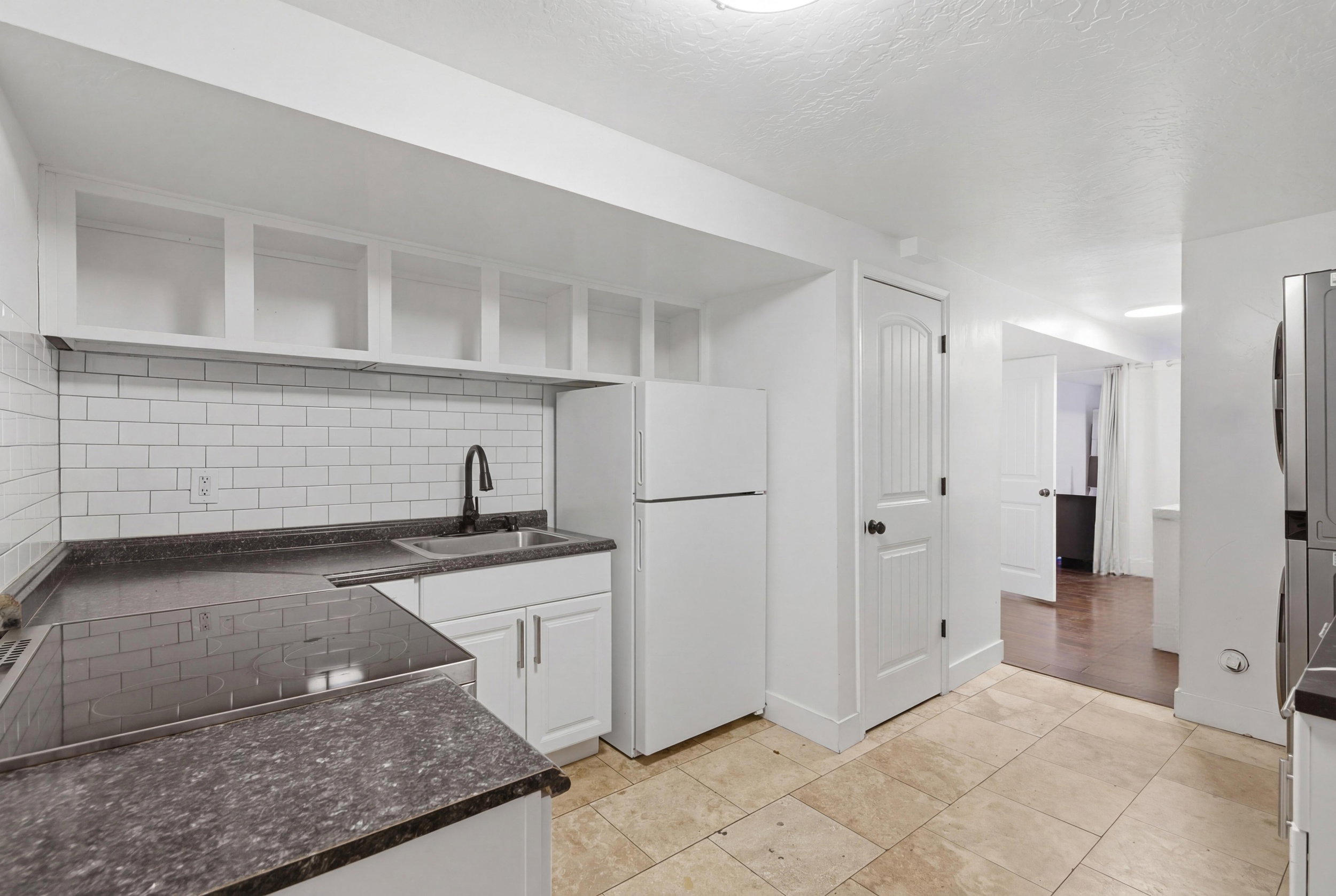 Basement kitchen with laundry.