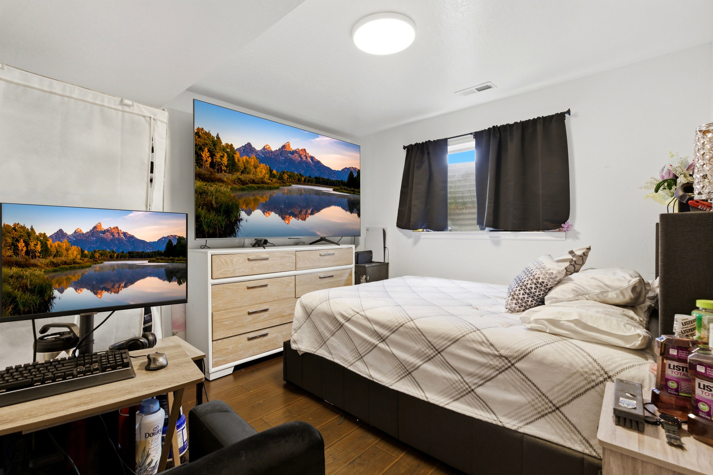 Basement living room, currently being used as a third bedroom.