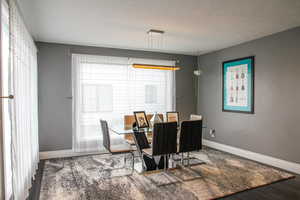 Dining room with baseboards and wood finished floors