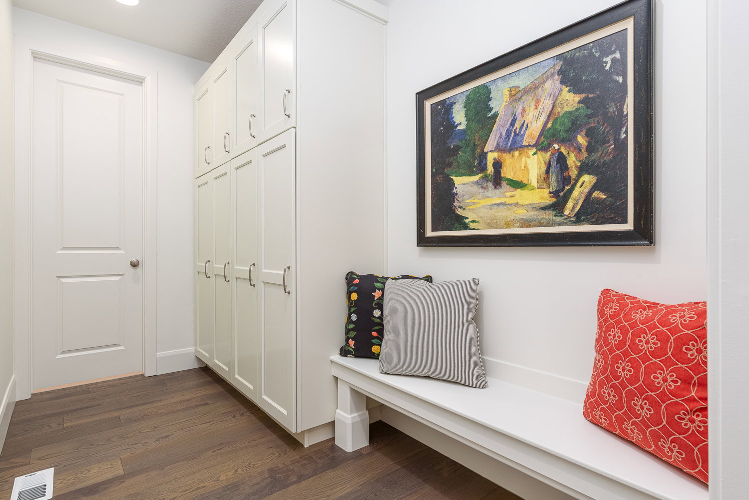 Mudroom with dark wood-style flooring and baseboards