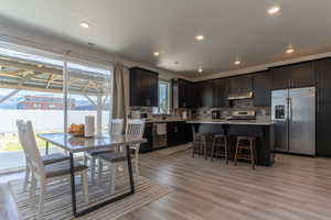 Dining space featuring light wood-style floors and recessed lighting