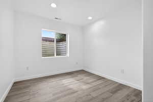Spare room featuring recessed lighting and light wood-style floors