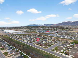 Aerial perspective of suburban area featuring a mountainous background