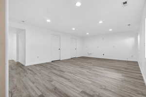 Spare room with recessed lighting and light wood-style floors