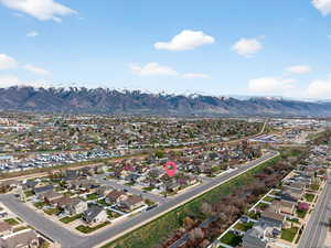 Aerial perspective of suburban area with a mountain backdrop
