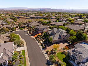 Aerial view of residential area featuring a mountainous background
