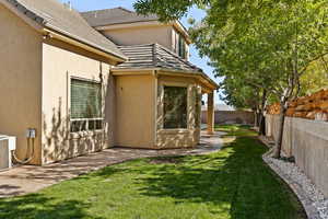 View of home's exterior with a fenced backyard and stucco siding
