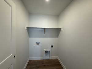 Laundry area with dark wood-style flooring, electric dryer hookup, and washer hookup