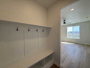 Mudroom with recessed lighting, light wood-type flooring, a textured ceiling, and ceiling fan