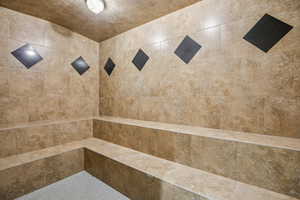 Full bath with tiled shower