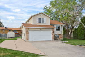 Clean curb appeal with extended driveway and 2-car garage—offering plenty of parking and easy access, all just minutes from HAFB and a quick drive to SLC or the mountains.