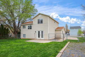 Fully fenced backyard with spacious lawn, patio area, and convenient gate access. Perfect for entertaining, pets, or relaxing outdoor living with plenty of room to play.