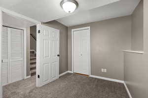 Alternate view of basement bedroom featuring closet space, neutral finishes, and a functional layout. Ideal for guests, a home office, or additional living space with privacy and versatility.
